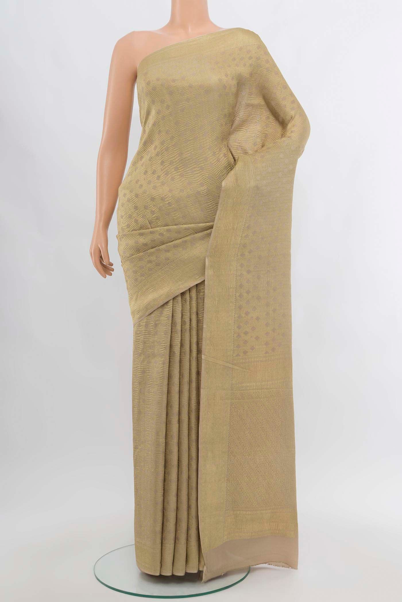 Beige Mysore Crepe Saree with Zari Butta on the body and Silk Border displayed on a mannequin