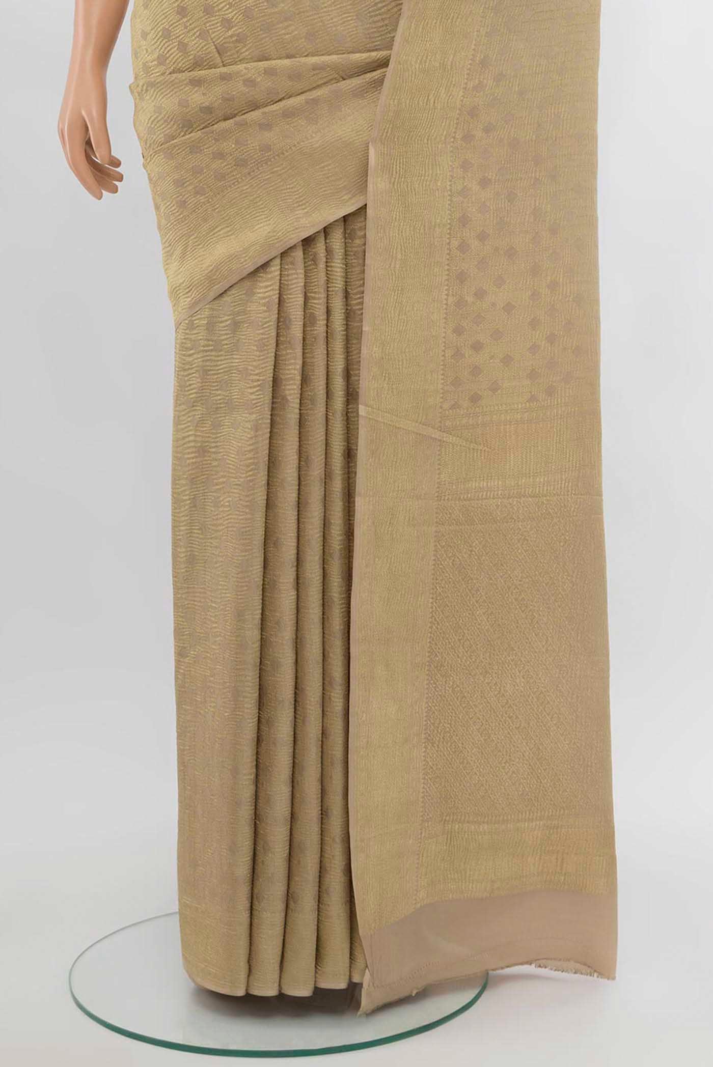 Pleats and pallu of Beige Mysore Crepe Saree with Zari Butta on the body and Silk Border