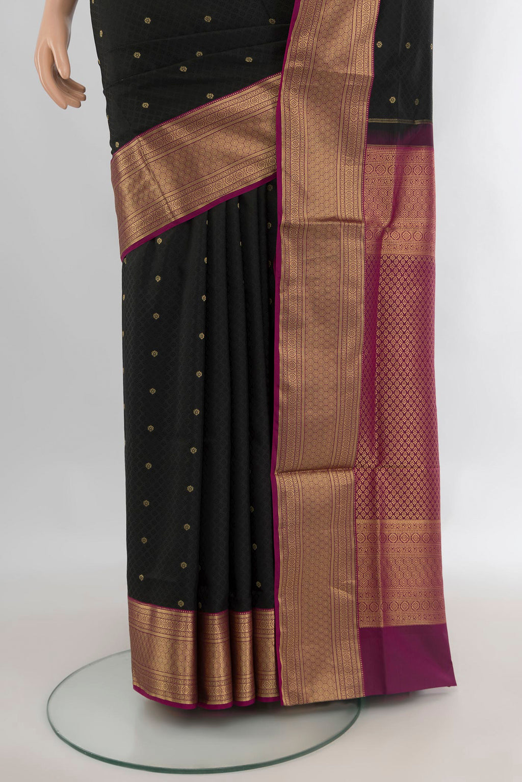 Pleats and pallu of Pure Silk Black Soft Saree with Jacquard design on the body and Zari Border. 