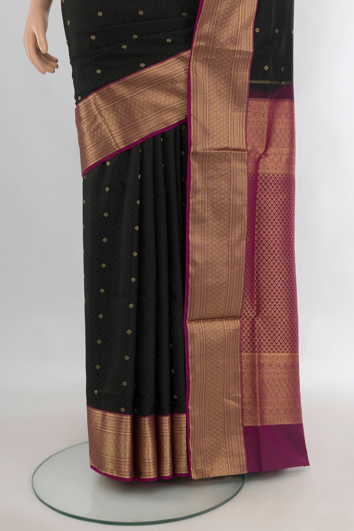 Pleats and pallu of Pure Silk Black Soft Saree with Jacquard design on the body and Zari Border. 