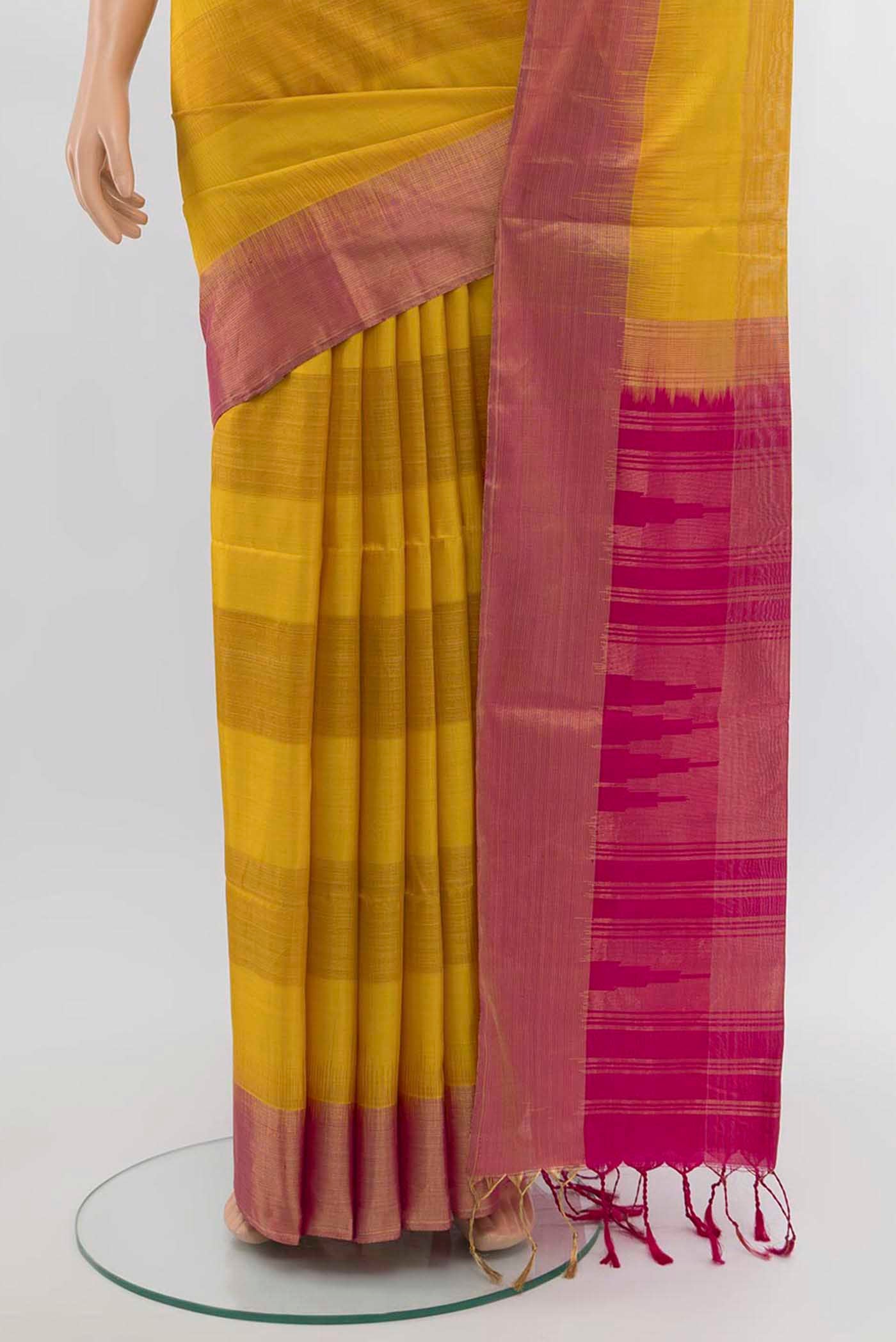 Pleats and pallu of Mustard Soft Silk Saree with Zari Butta on the body and Silk Border