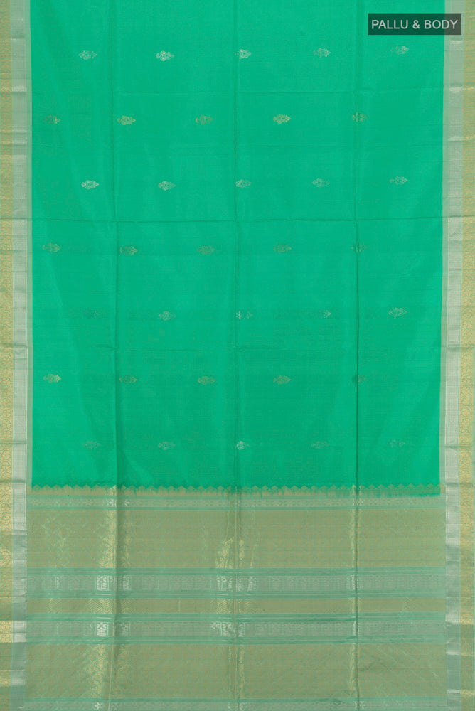 Flat view of Light Green Soft Silk Saree with Zari Butta on the body and Silk Border. 