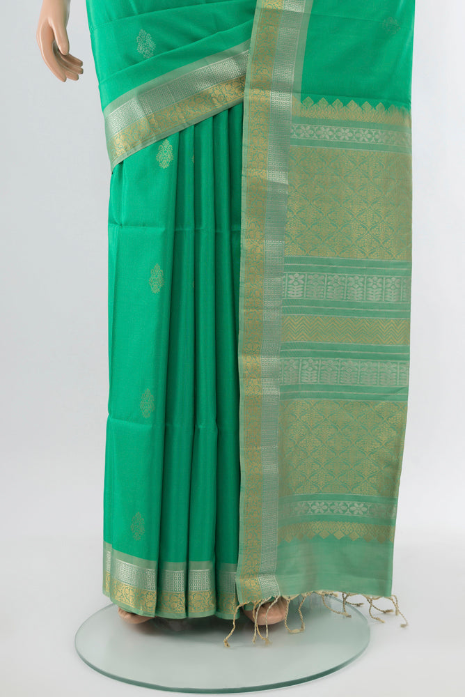 Pleats and pallu of Light Green Soft Silk Saree with Zari Butta on the body and Silk Border. 