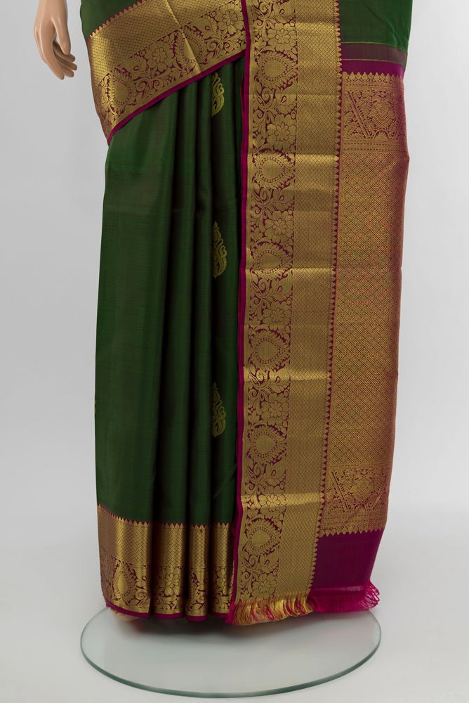 Pleats and pallu of Mint Green Kanchipuram Silk Saree with Zari Butta on the body and Silk Border. 