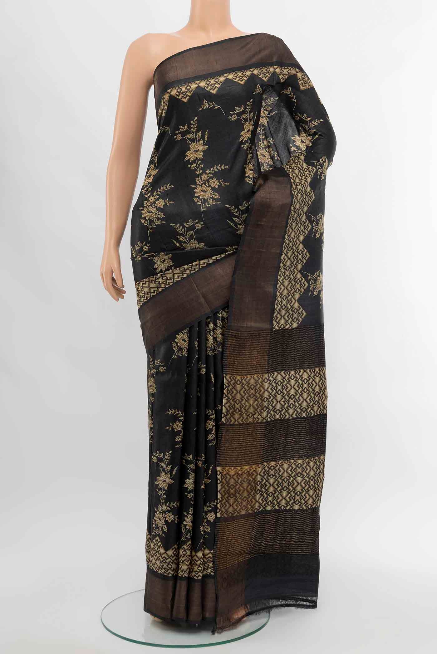 Grey Tussar Silk Saree with Floral Print on the body and Silk Border displayed on a mannequin