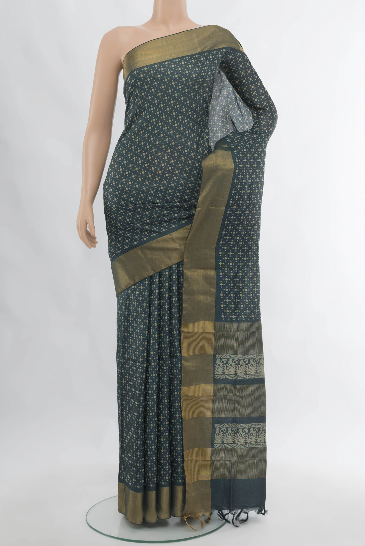 Navy Blue Tussar Silk Saree with Floral Print on the body and Silk Border.  displayed on a mannequin