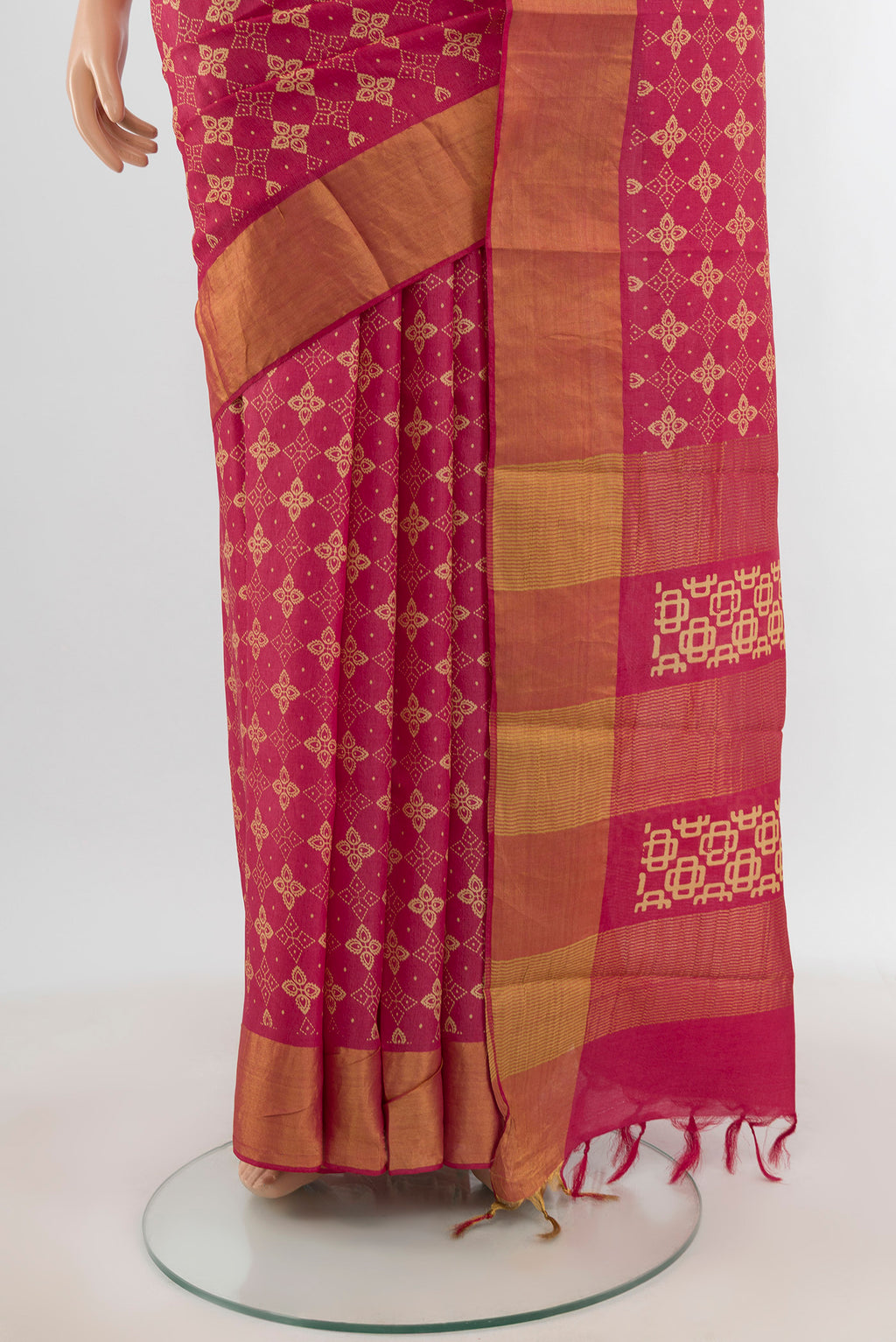 Pleats and pallu of Pink Tussar Silk Saree with Floral Print on the body and Zari Border. 