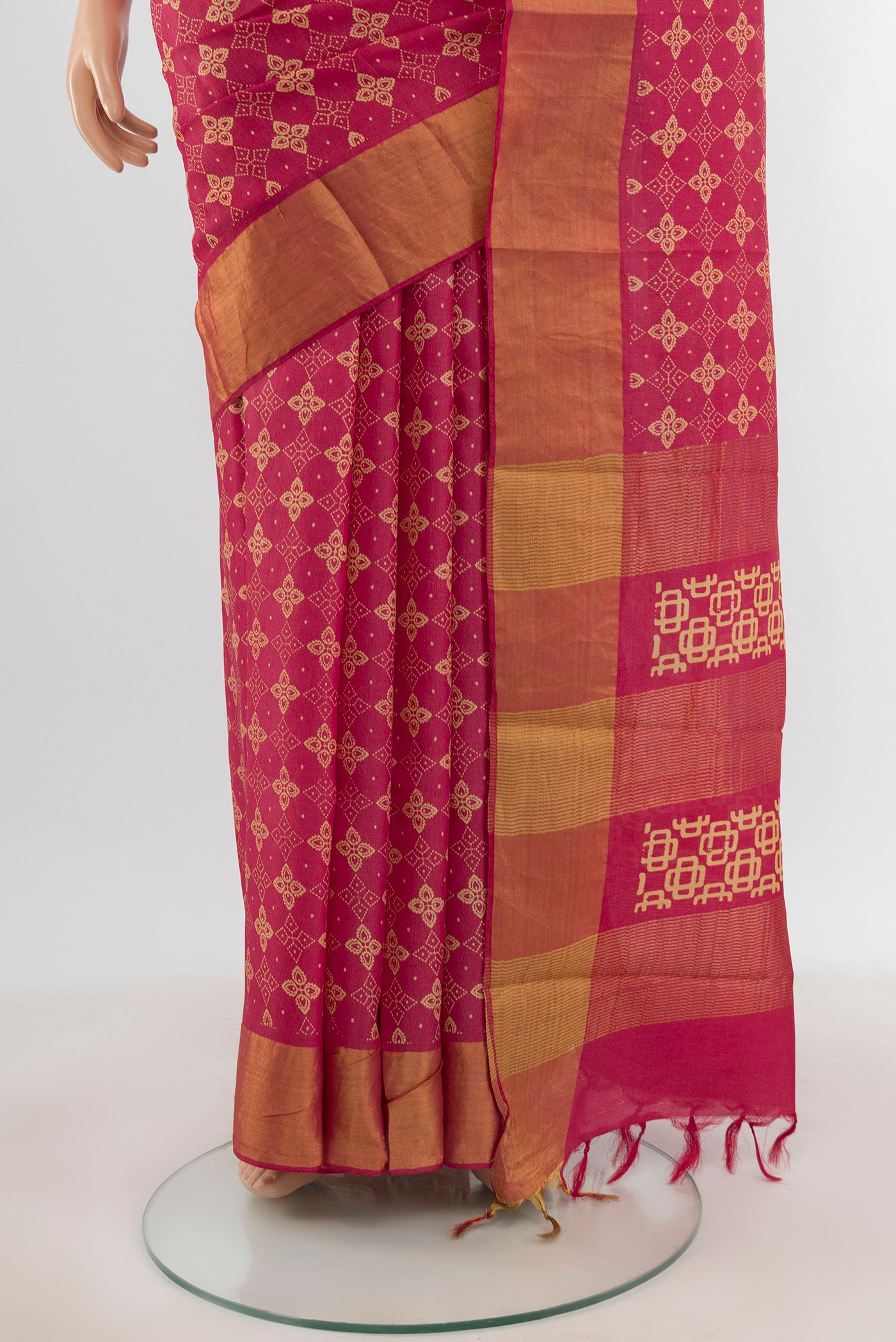 Pleats and pallu of Pink Tussar Silk Saree with Floral Print on the body and Zari Border. 