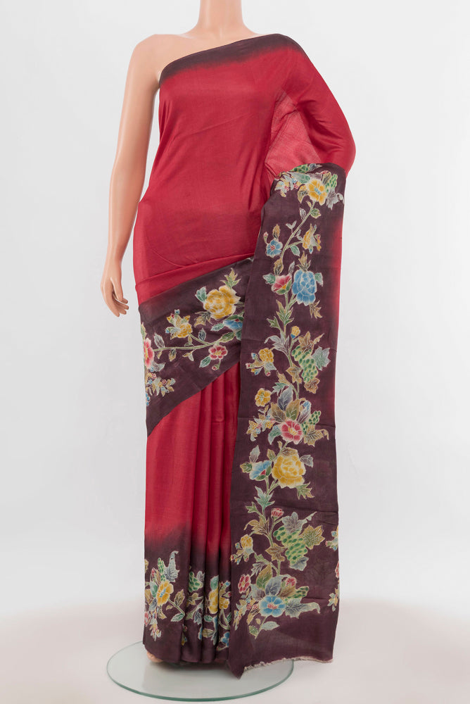 Maroon Tussar Silk Saree with Floral Print on the body and Silk Border.  displayed on a mannequin