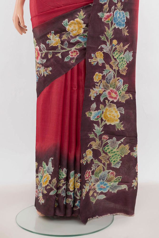 Pleats and pallu of Maroon Tussar Silk Saree with Floral Print on the body and Silk Border. 