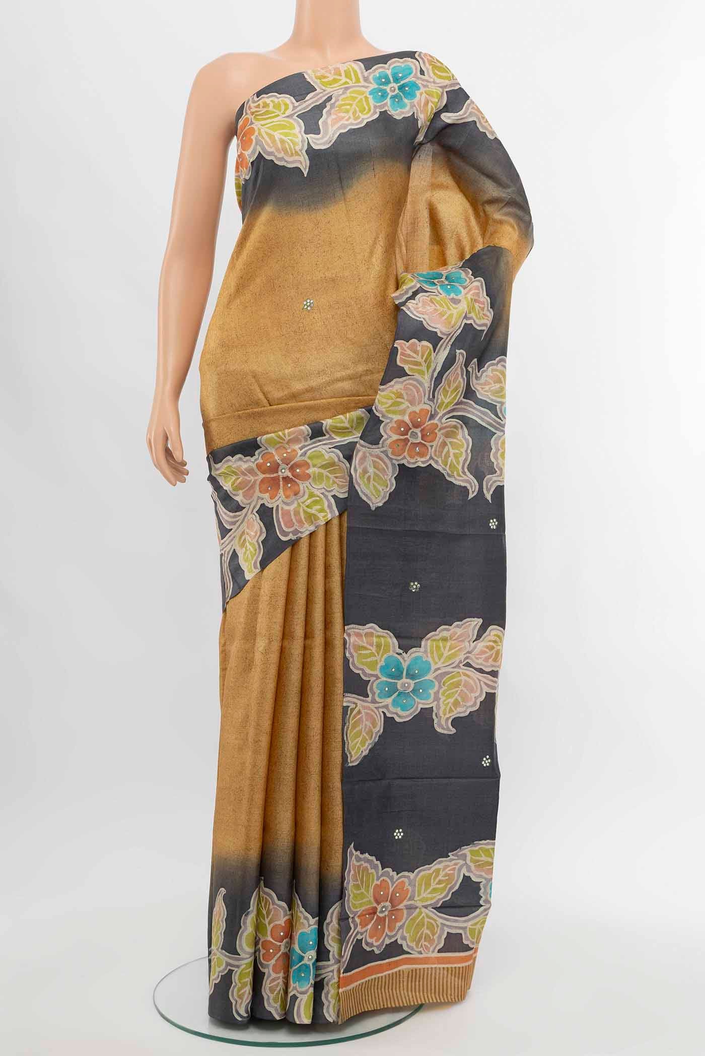 Beige Tussar Silk Saree with Floral Print on the body and Silk Border displayed on a mannequin