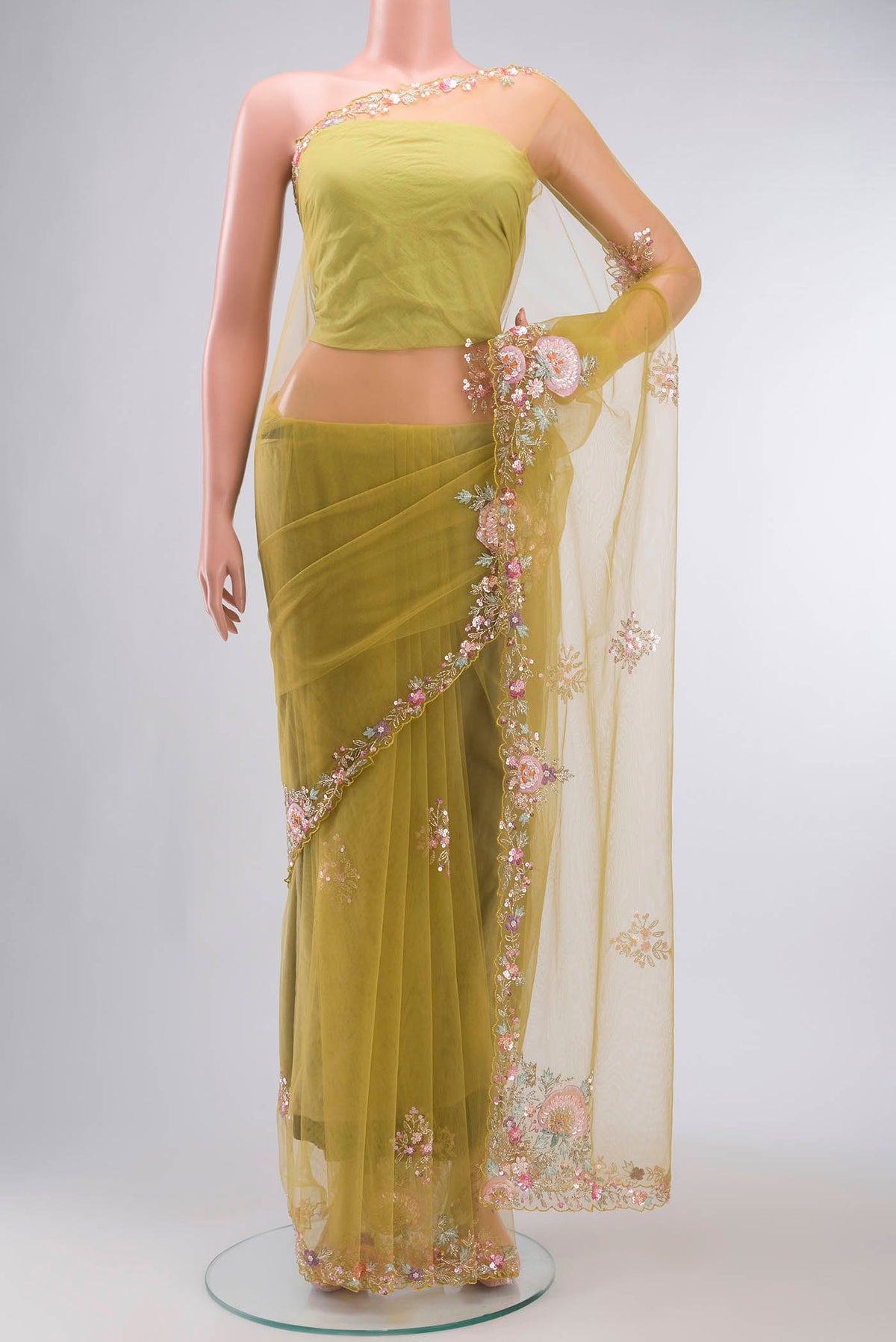 Green Embroidery Net Saree with Embroidery on the body and Embroidery Border displayed on a mannequin