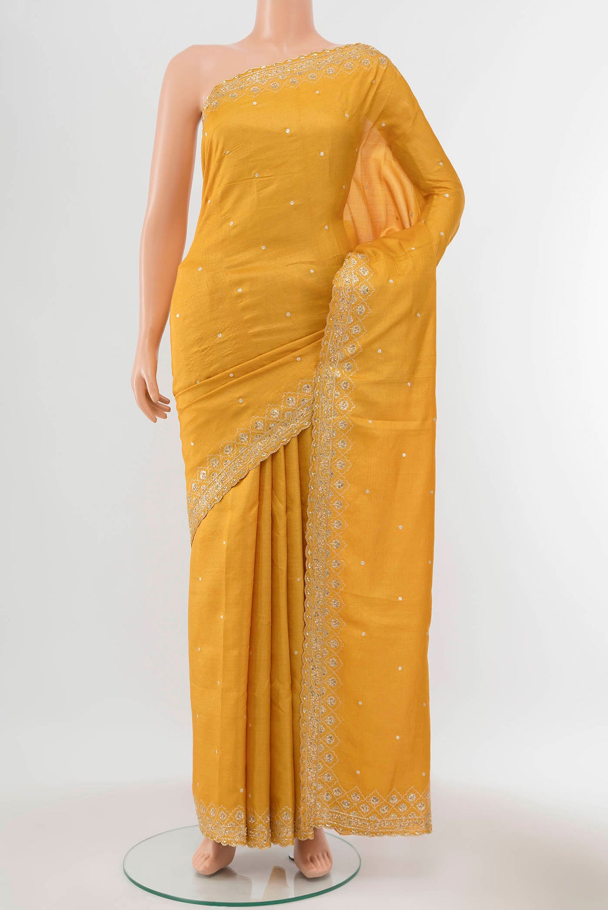 Yellow Tussar Silk Saree with Zari Butta on the body and Silk Border displayed on a mannequin