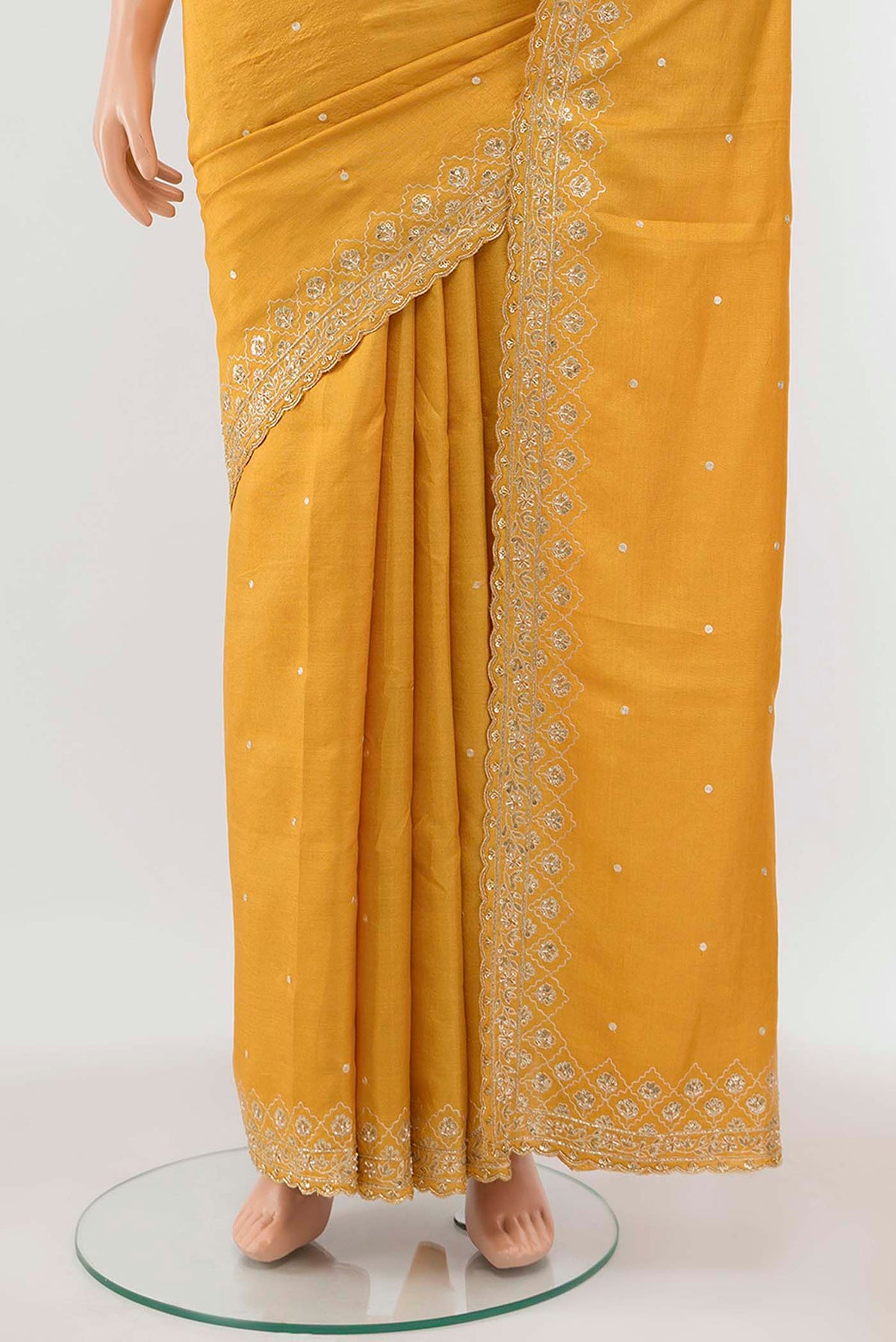 Pleats and pallu of Yellow Tussar Silk Saree with Zari Butta on the body and Silk Border