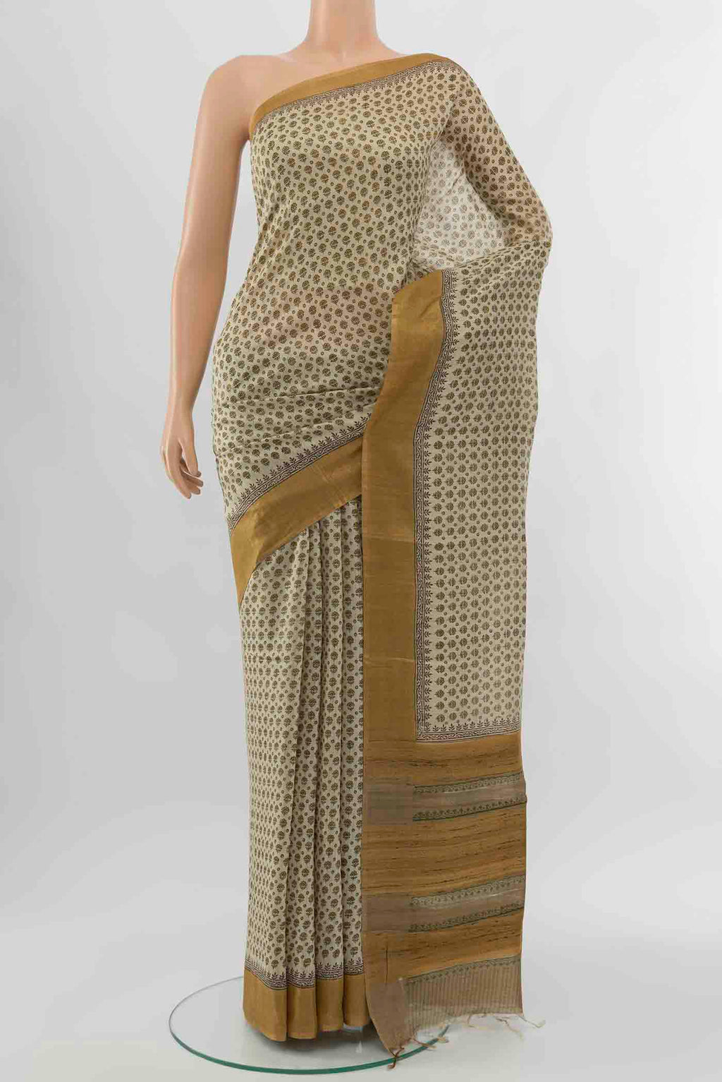Beige Tussar Silk Saree with Floral Print on the body and Silk Border displayed on a mannequin