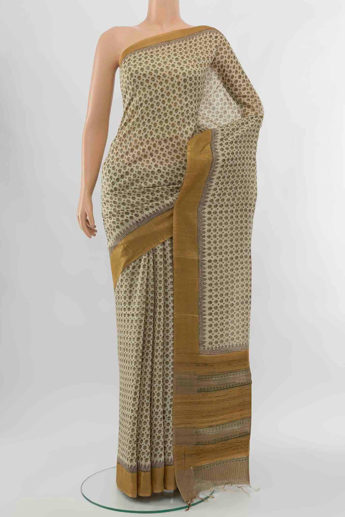 Beige Tussar Silk Saree with Floral Print on the body and Silk Border displayed on a mannequin