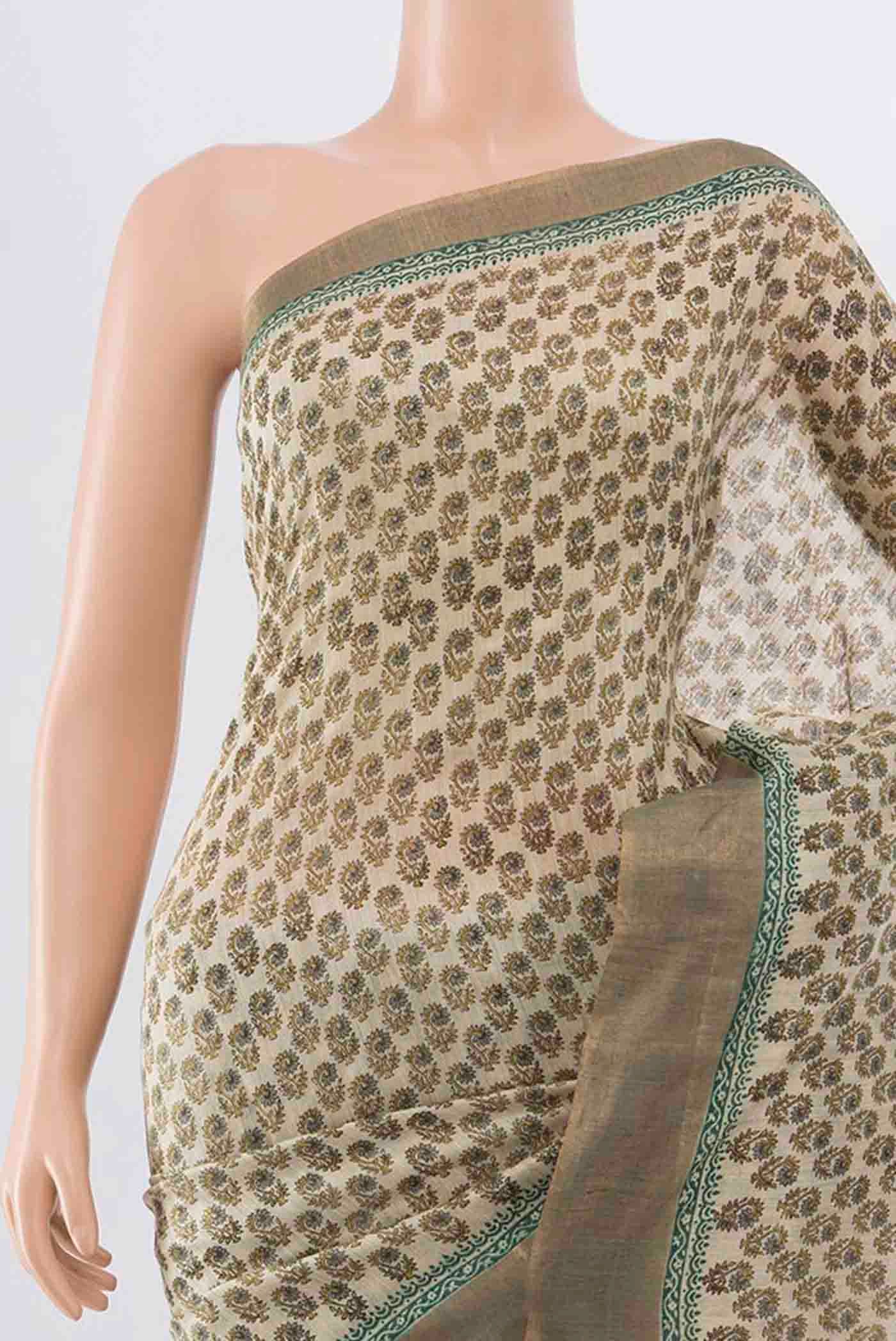 Border image of Beige Tussar Silk Saree with Floral Print on the body and Zari Border