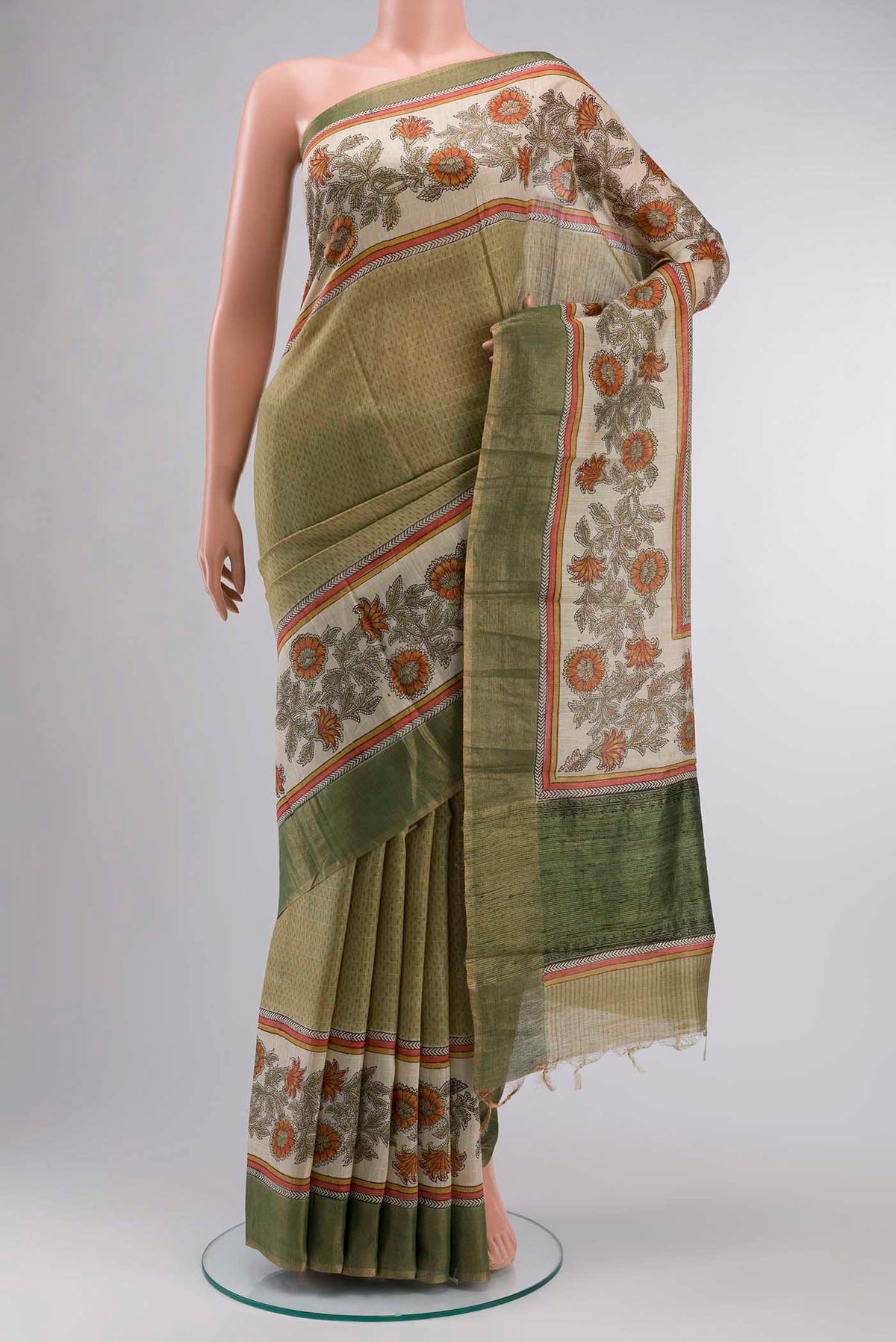Green Bhagalpuri Tussar Silk Saree With Printed design on the body and Zari Border displayed on a mannequin