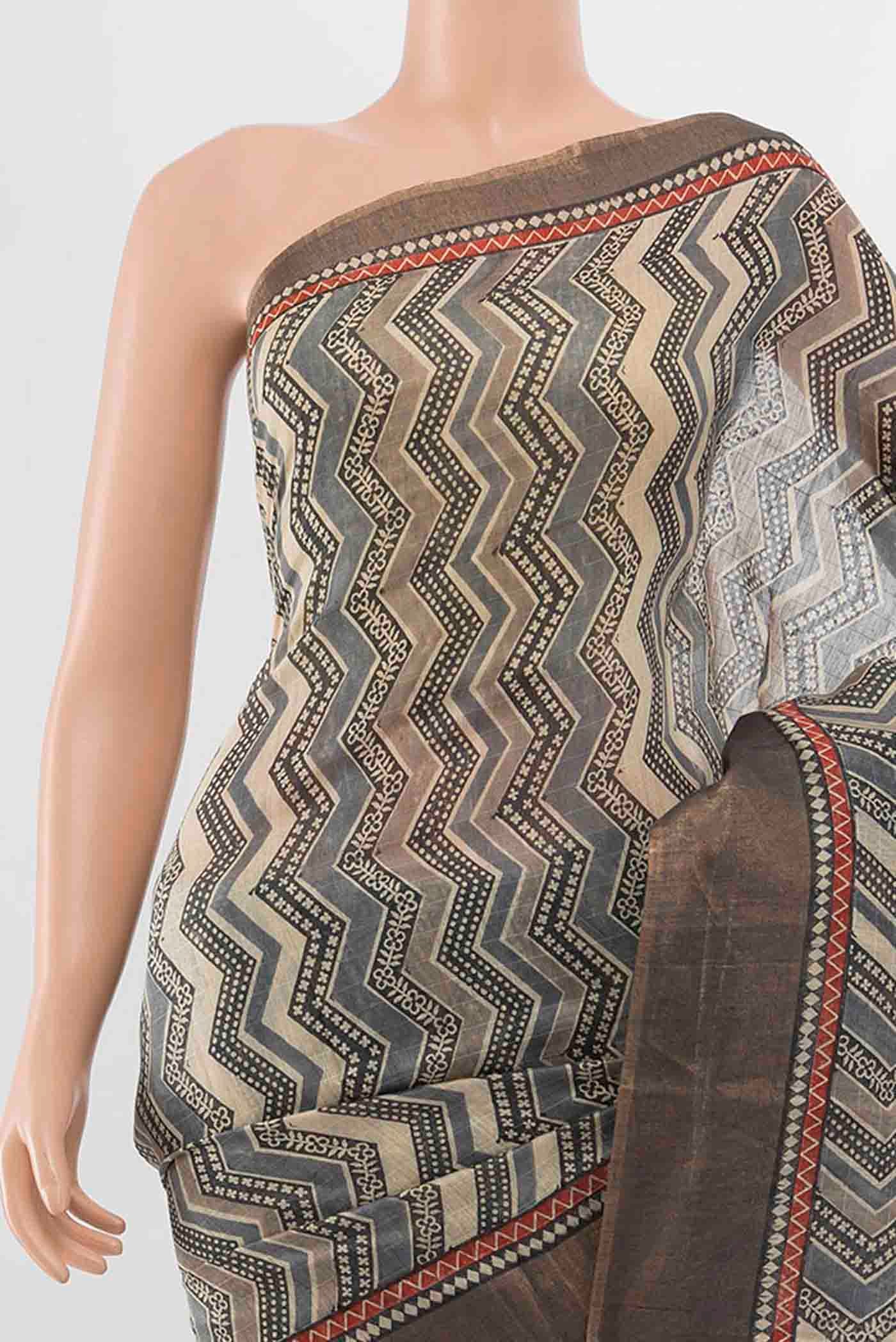 Border image of Grey Tussar Silk Saree with Geometric Print on the body and Zari Border