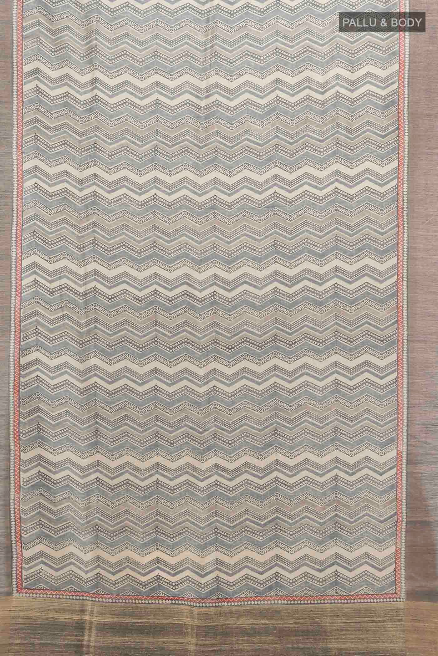Flat view of Grey Tussar Silk Saree with Geometric Print on the body and Zari Border