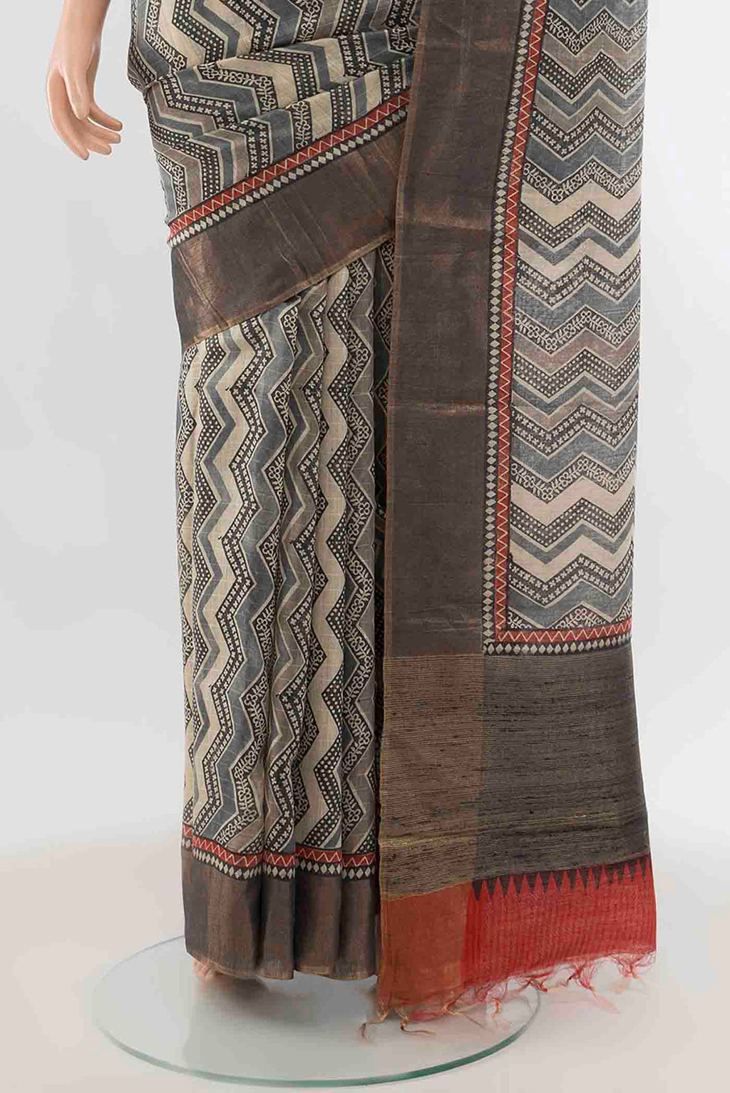 Pleats and pallu of Grey Tussar Silk Saree with Geometric Print on the body and Zari Border
