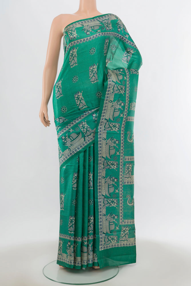 Light Blue Tussar Saree with Floral Print on the body and Silk Border.  displayed on a mannequin