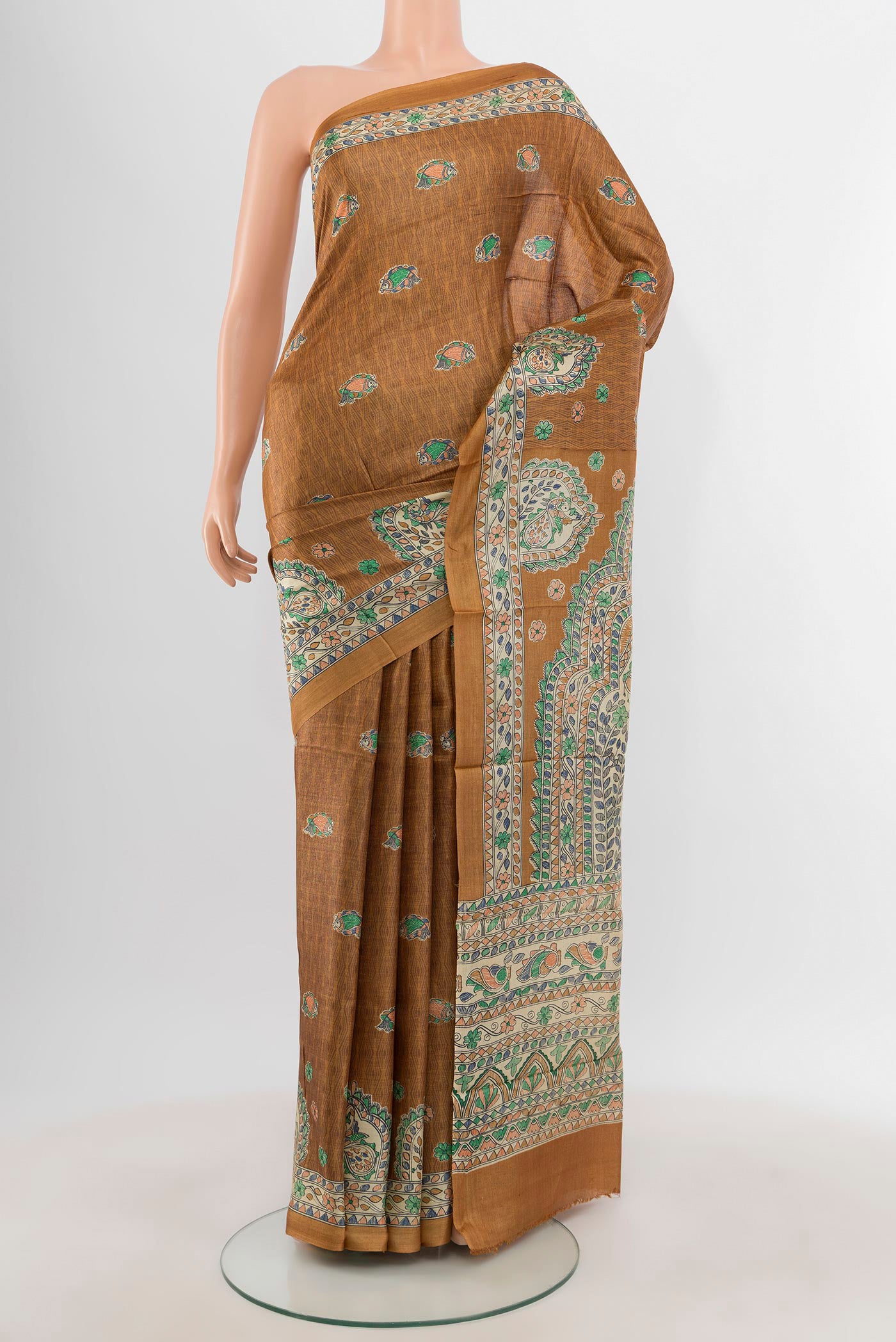 Brown Tussar Silk Saree with Floral Print on the body and Printed Border.  displayed on a mannequin