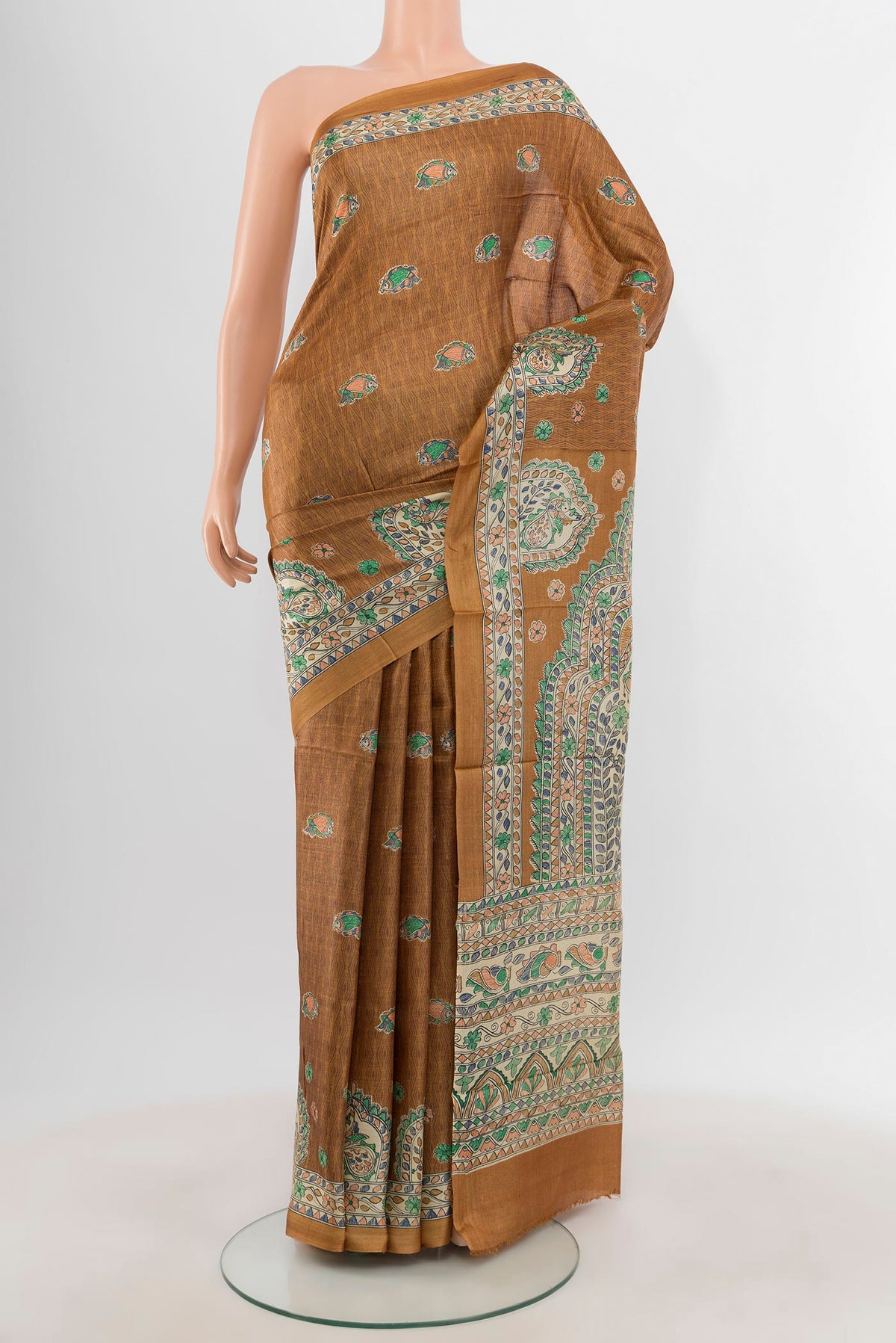 Brown Tussar Silk Saree with Floral Print on the body and Printed Border.  displayed on a mannequin