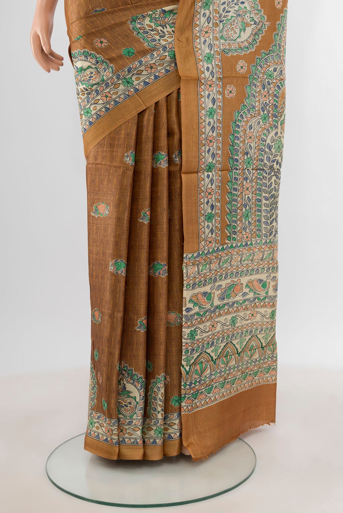 Pleats and pallu of Brown Tussar Silk Saree with Floral Print on the body and Printed Border. 
