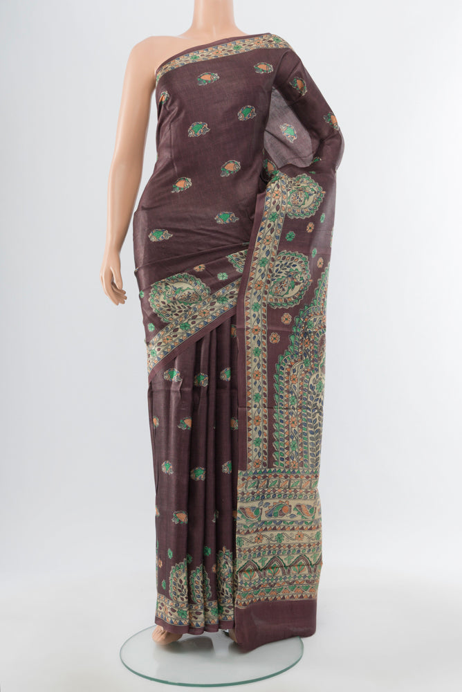 Brown Tussar Silk Saree with Floral Print on the body and Silk Border.  displayed on a mannequin