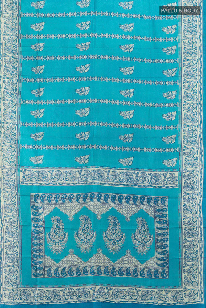 Flat view of Light Blue Tussar Silk Saree with Floral Print on the body and Silk Border. 
