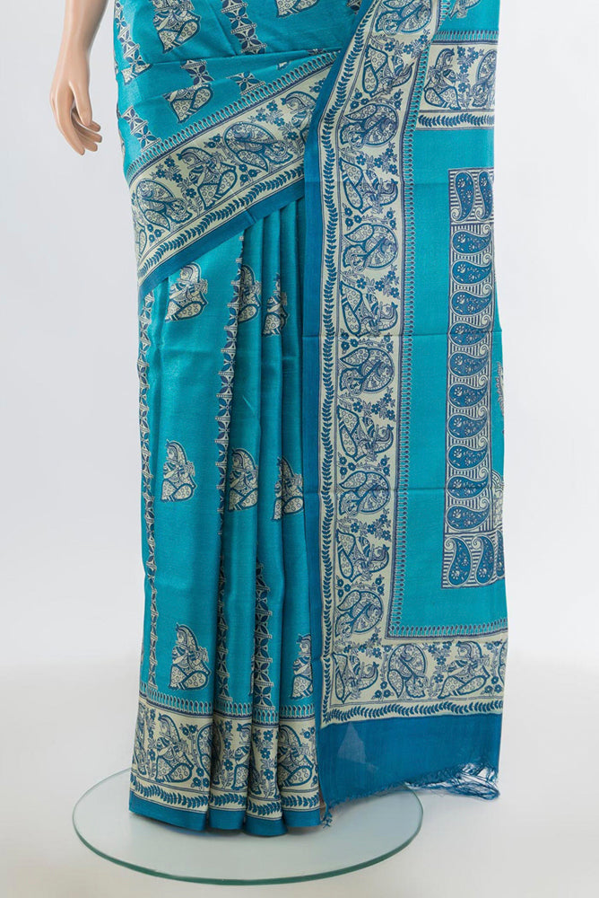 Pleats and pallu of Light Blue Tussar Silk Saree with Floral Print on the body and Silk Border. 