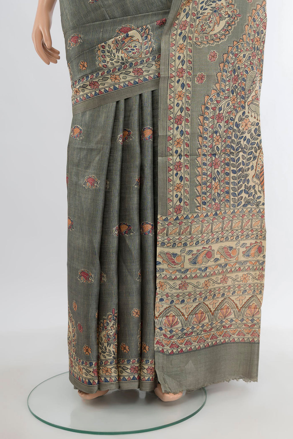 Pleats and pallu of Green Tussar Silk Saree with Printed design on the body and Printed Border. 