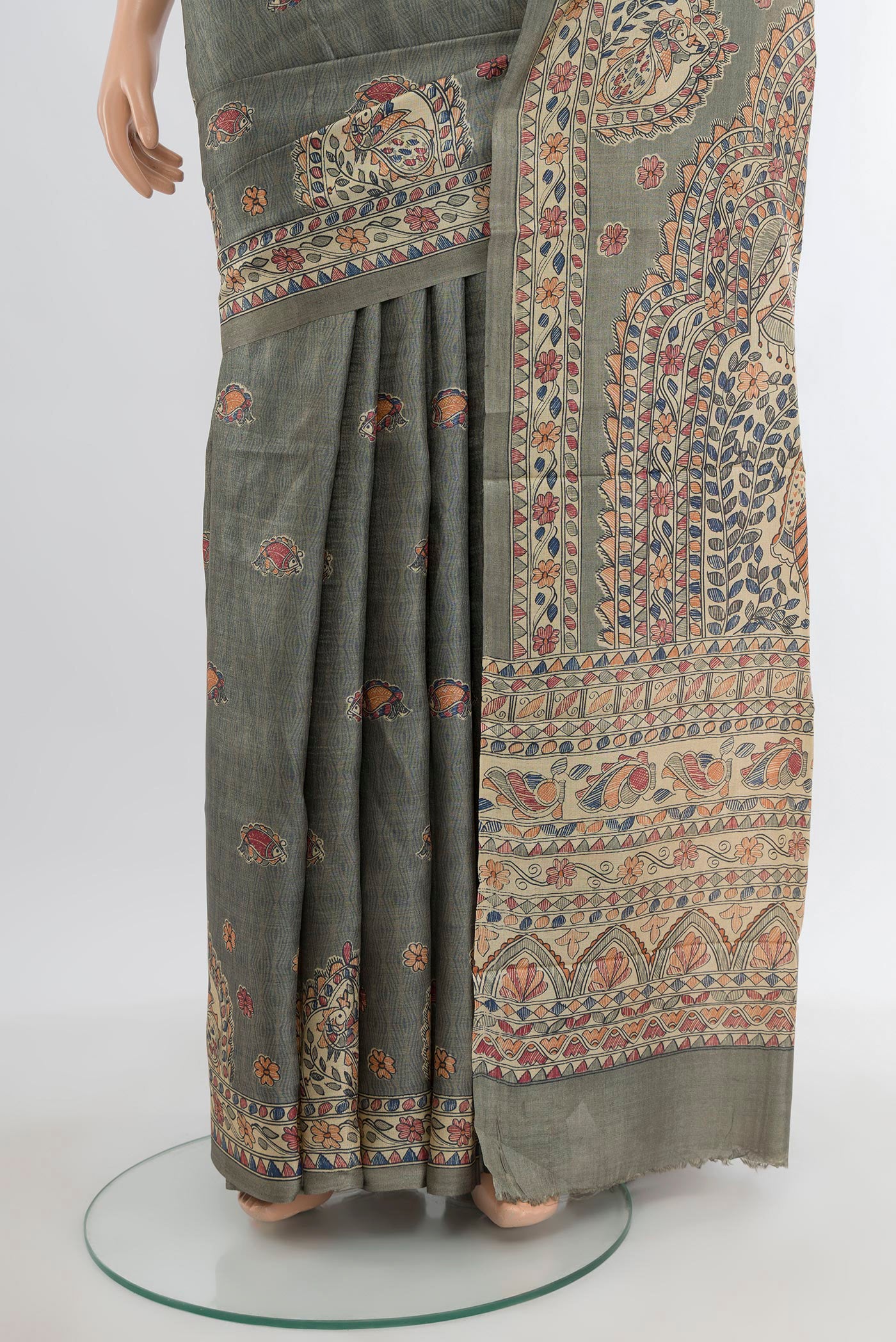 Pleats and pallu of Green Tussar Silk Saree with Printed design on the body and Printed Border. 