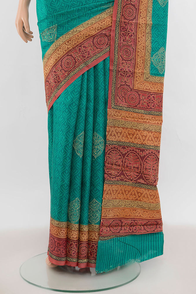 Pleats and pallu of Peacock Blue Tussar Silk Saree with Floral Print on the body and Thread Border. 