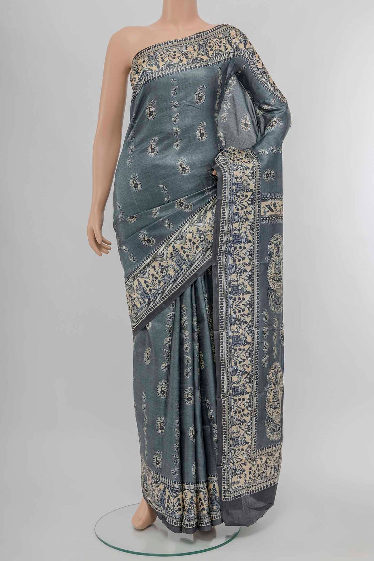 Grey Tussar Saree with Printed design on the body and Fancy Border displayed on a mannequin
