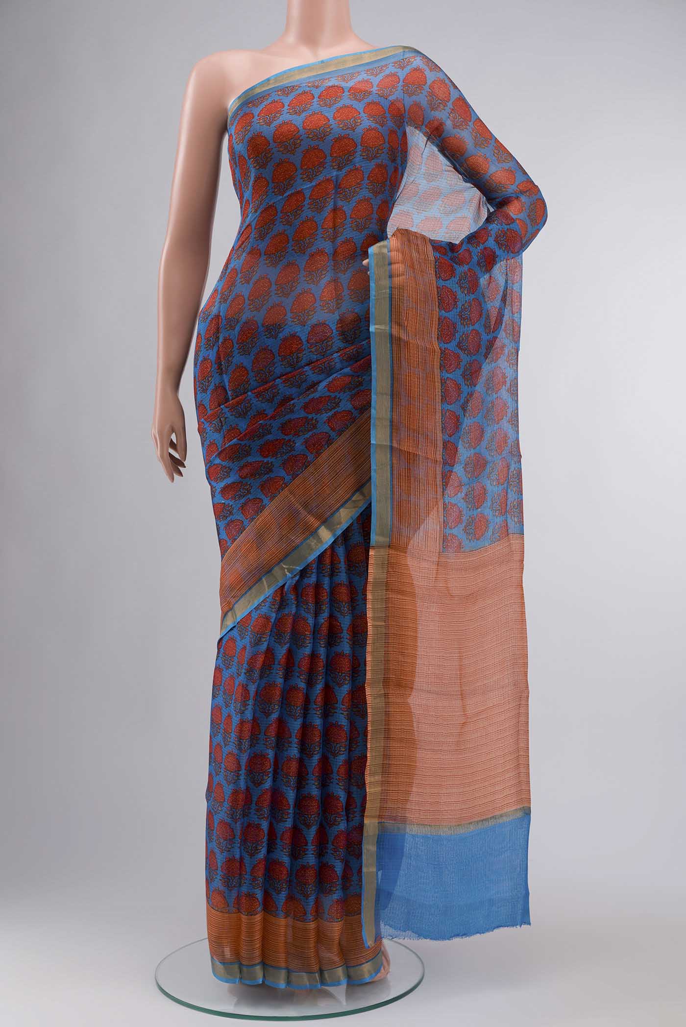 Blue Kota Silk Saree With Printed design on the body and Zari Border displayed on a mannequin