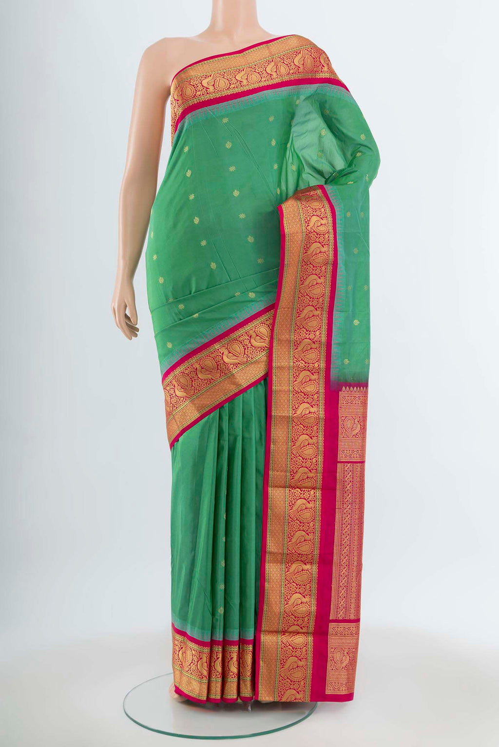Light Green Bangalore Silk Saree with Zari Butta on the body and Silk Border.  displayed on a mannequin