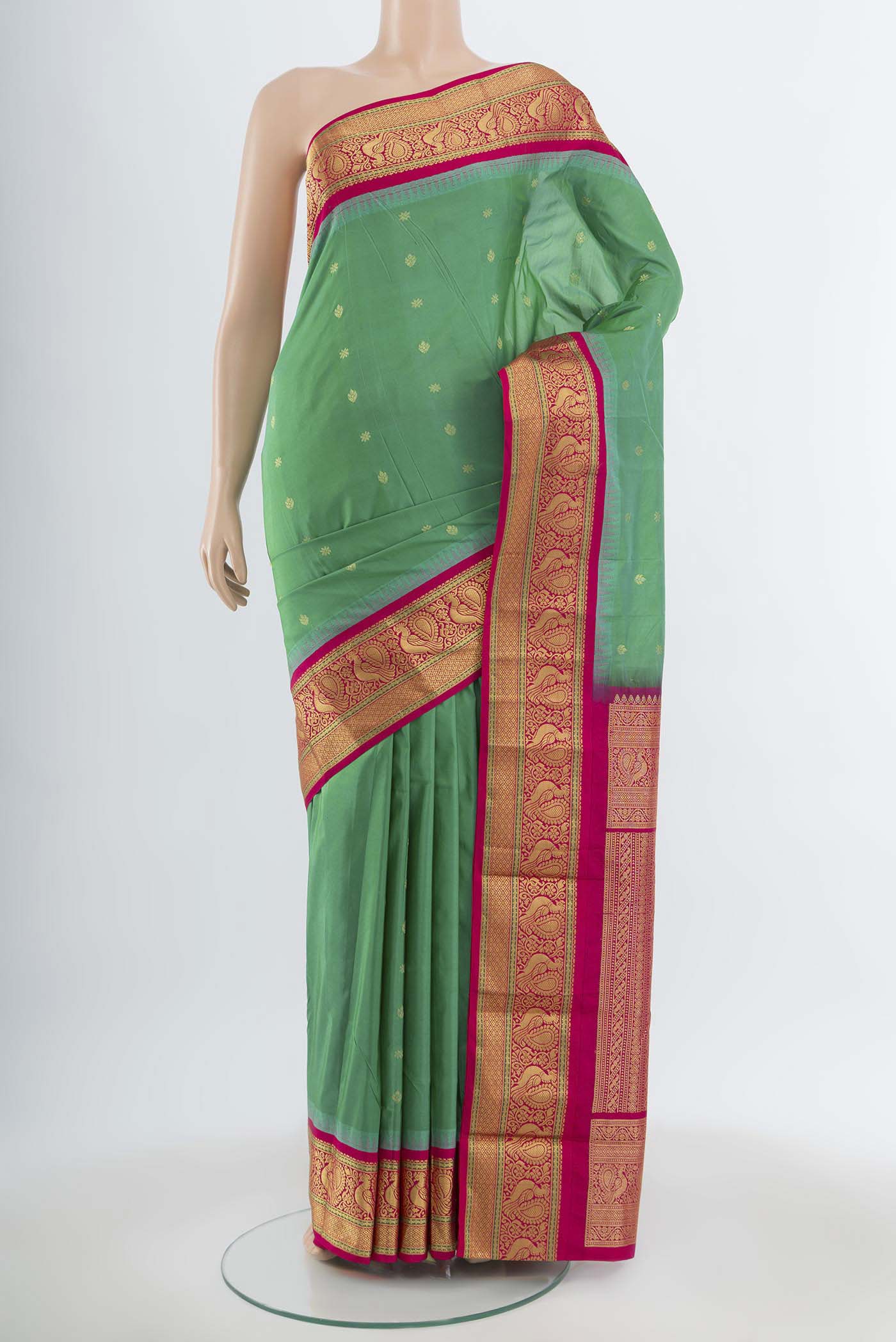 Light Green Bangalore Silk Saree with Zari Butta on the body and Silk Border.  displayed on a mannequin