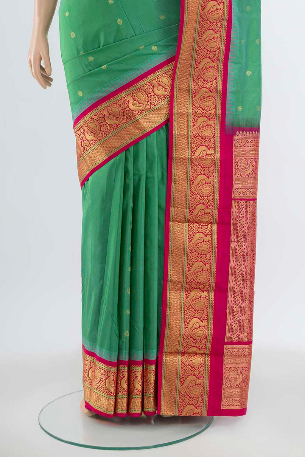 Pleats and pallu of Light Green Bangalore Silk Saree with Zari Butta on the body and Silk Border. 