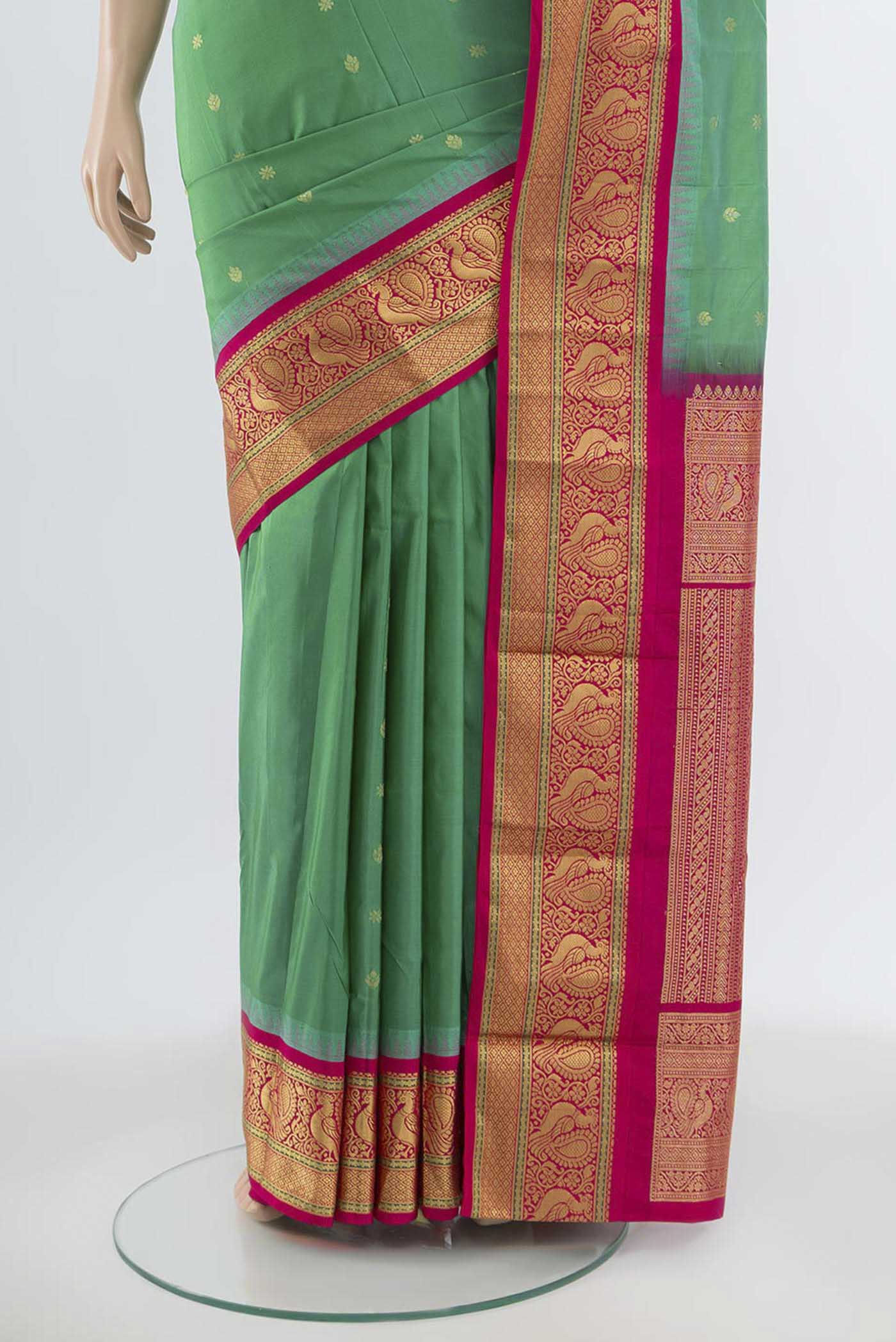 Pleats and pallu of Light Green Bangalore Silk Saree with Zari Butta on the body and Silk Border. 