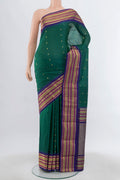 Peacock Blue Bangalore Silk Saree with Zari Butta on the body and Silk Border.  displayed on a mannequin