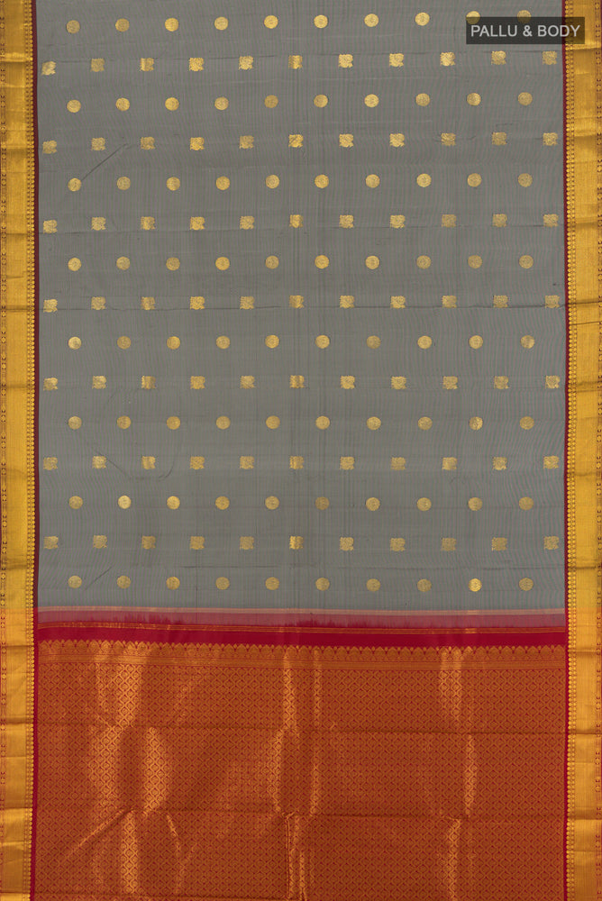 Flat view of Davys Grey Kanchipuram Silk Saree with Zari Butta on the body and Silk Border. 