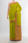 Light Green Kanchipuram Silk Saree with Zari Butta on the body and Zari Border.  displayed on a mannequin