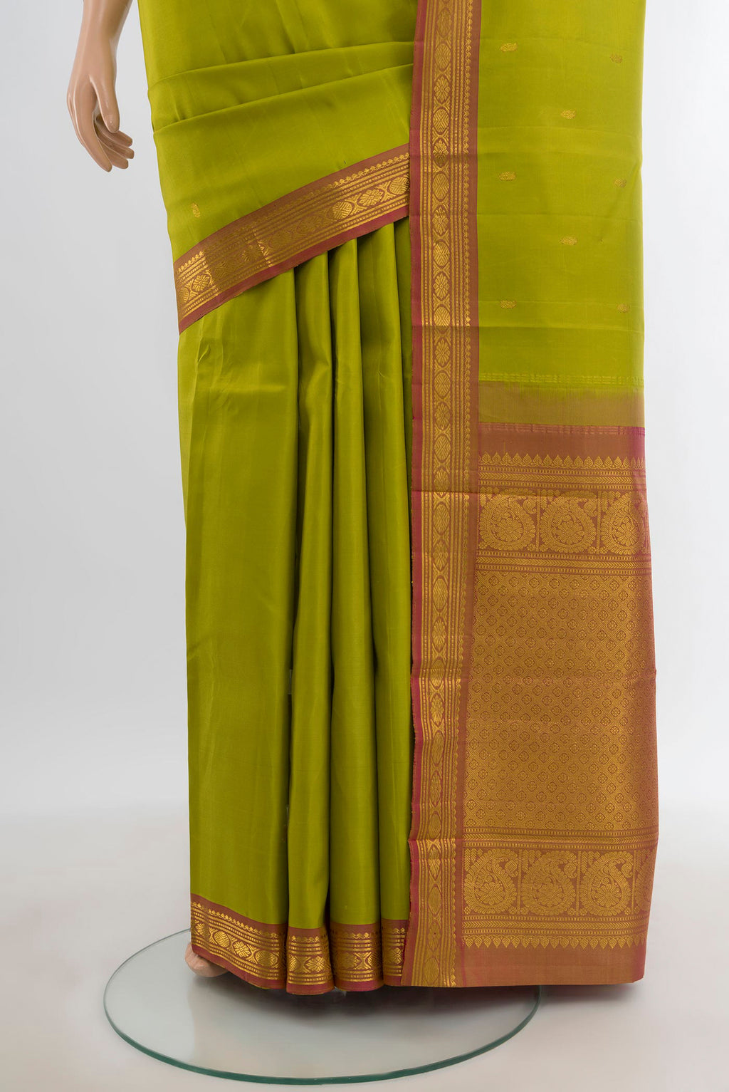 Pleats and pallu of Light Green Kanchipuram Silk Saree with Zari Butta on the body and Zari Border. 
