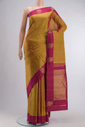 Mustard Kanchipuram Silk Saree with Zari Butta on the body and Zari Border displayed on a mannequin