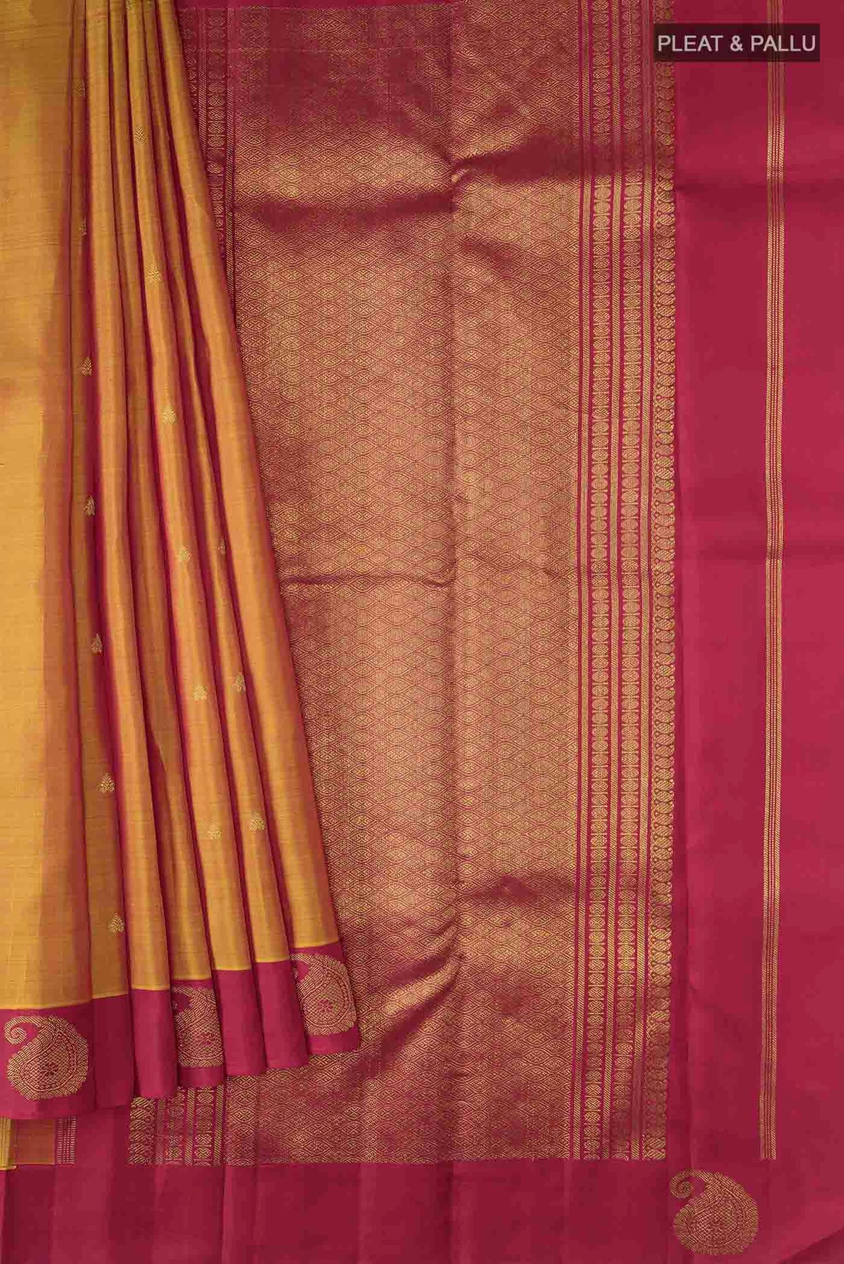 Pleats and pallu of Mustard Kanchipuram Silk Saree with Zari Butta on the body and Zari Border