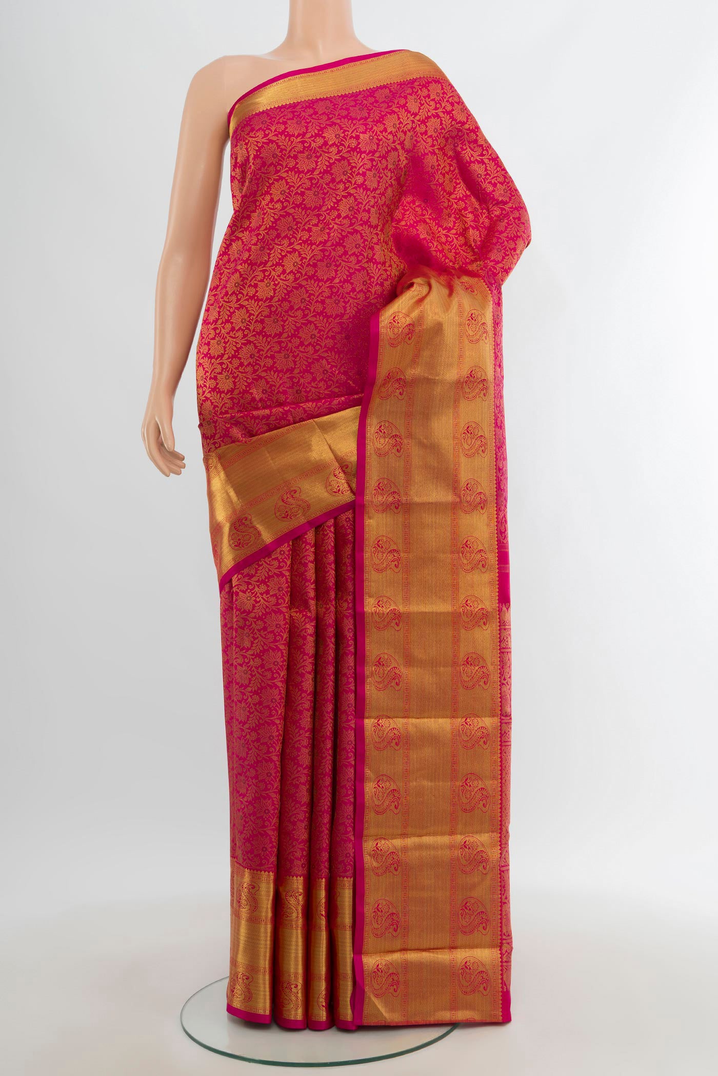Pure Silk Pure Zari Pink Kanjivaram Saree with Zari Brocade on the body and Zari Border.  displayed on a mannequin