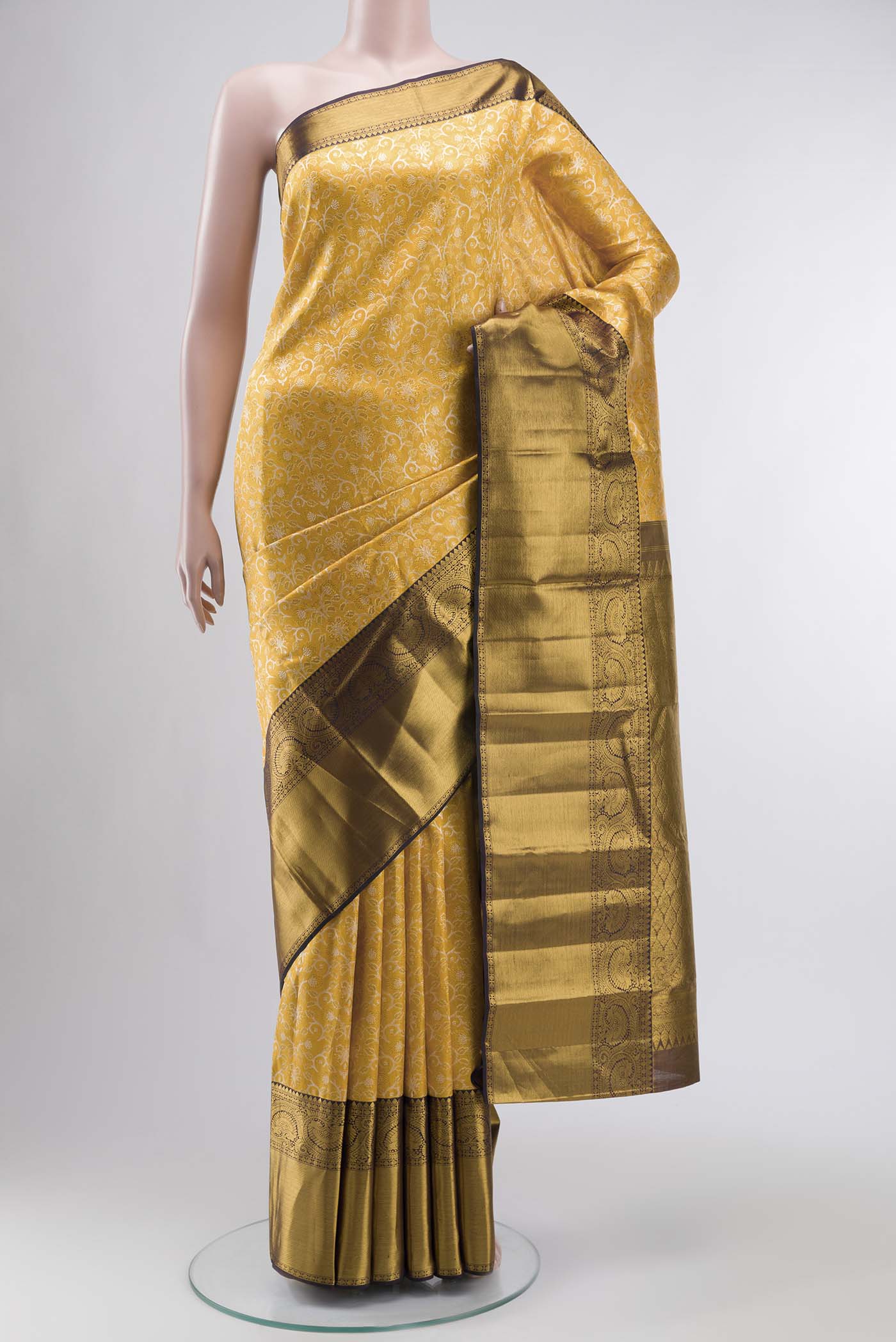 Pure Silk Pure Zari Yellow Kanchipuram Saree with Zari Brocade on the body and Zari Border displayed on a mannequin