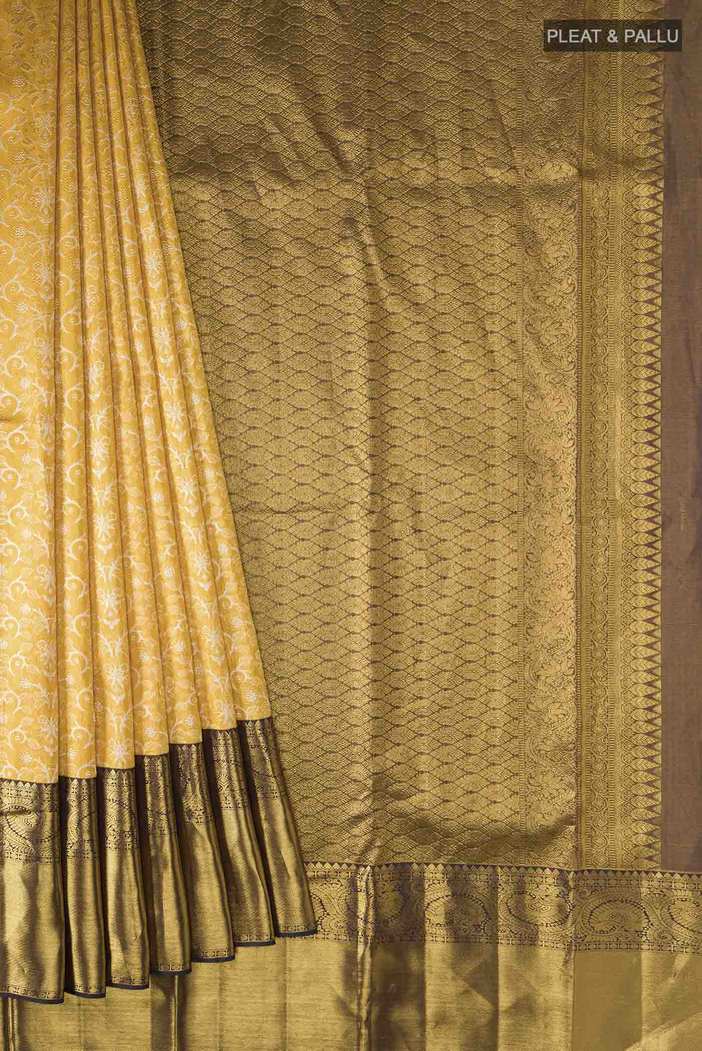Pleats and pallu of Pure Silk Pure Zari Yellow Kanchipuram Saree with Zari Brocade on the body and Zari Border